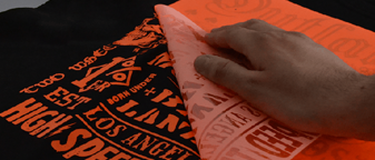 Heat transfer vinyl being peeled from a printed garment